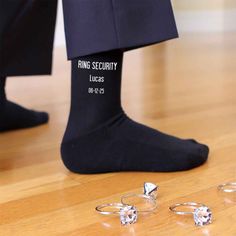 This super cool design for the ring bearer is printed on our black or navy flat knit dress socks or white ribbed crew socks and makes a great wedding accessory and gift. Please enter the name and wedding date to be printed on the socks. Orders with missing information will take longer to process. Personalize a pair of socks for the special day by adding the name and wedding date to the socks. Sock size 6-8 1/2 fits a kids shoe size 9-2, ages 5-9 Cotton/nylon blend Machine wash warm, bleach produ Ring Security Wedding, Groom Socks, Ring Security, Ring Bearer Gifts, Wedding Socks, Navy Flats, Personalized Socks, Bleach Product, Wedding Engagement Gifts