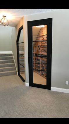 an empty room with stairs leading up to the second floor