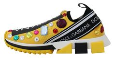 Dazzle your steps with these Dolce & Gabbana Sorrento Sneakers, crafted with passion in Italy. Featuring a striking yellow hue, these sneakers are a perfect blend of style and comfort. The luxurious techno fabric is adorned with sparkling rhinestones and the distinguished brand logo, ensuring you make a statement with every move. Designed for the fashion-forward individual, these shoes offer a snug fabric inner and a robust rubber cleated sole for enduring wear. Brand new with tags and unparalleled in craftsmanship, step into elegance with these enchanting sneakers. Color: Yellow Material: 70% Polyester, 5% Elastane, 2% Algodon Sole: Rubber Logo details Country of origin: Italy Dolce Gabbana Sneakers, Embroidery Shoes, Shoe Art, Dolce E Gabbana, Boot Pumps, Sorrento, Dolce & Gabbana, Sunglass Frames, Sneakers Shoes