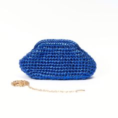 Meet our metallic blue clutch bag, its hand crochet with leather effect yarn. We specially designed it to accompany you for your special events and also make your day special 🤩 It is a perfect gift idea for women ! > It is exclusively hand crochet > It is made of ecologically colored metallic polyester yarn > It has a special metal bourse mechanism for an easy closing and stylish look. > You can choose to use it as a clutch or a crossbody bag with a metal chain strap. > Measurements are: W : 25 Luxury Blue Pouch Clutch, Trendy Blue Clutch For Gift, Trendy Blue Clutch For Formal Occasions, Chic Blue Shoulder Bag Gift, Chic Blue Shoulder Bag For Gift, Trendy Blue Evening Clutch, Luxury Crochet Pouch Bag For Evening, Blue Handmade Evening Bag For Everyday Use, Chic Blue Pouch Clutch