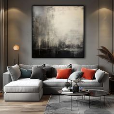 a living room filled with furniture and a painting on the wall