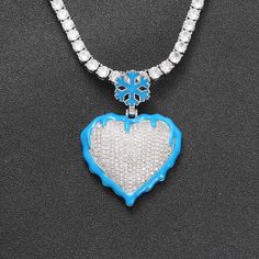 If you want to add instant flair to any style outfit, go for this iced-out ice-fire heart pendant necklace for men. This hip-hop rapper-style necklace bears a stunning luminous heart design and is ideal for parties, performances, or as a gift for someone special. This necklace is made with copper and micro-paved AAA CZ stone. What else are you waiting for, grab it now! Specifications Style: Hiphop/Rock Shape\pattern: Heart Product Style: Hip Hop Rapper Product Shape: Heart Pendant Size: 46*34mm Iced Out Pendant Necklace For Streetwear, Streetwear Iced Out Pendant Necklace, Souvenir Wedding, Ice Heart, Rapper Style, Custom Pendant, Party Necklace, Wedding Souvenirs, Custom Pendants