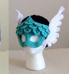 there is a crocheted mask on top of a mannequin head