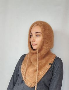 Warm Knitted Women Alpaca Hood This hood is ready to ship within 1-2 business days The hood will replace a whole set of accessories for you: a hat, a snood, a scarf, a neck warmer ... that is all in one. It will definitely not ruin your hairstyle and is very comfortable.  In a car or a store, you just take it off your head and wear it like a simple hood. One Size Fits Most Made with high quality mixed yarn: Alpaca+Mohair+merino wool+polyacryl.  Soft and light, skin friendly. Color: beige melange !! Colors may appear different on your monitor depending on your settings !! To order in another color: https://www.etsy.com/listing/1298452240/warm-knitted-women-hood-alpaca-hood?ref=listings_manager_grid Other Scarfs/Snoods: https://www.etsy.com/shop/BeTaKnitWear?section_id=25093929 Washing instr Cozy Hand Knitted Winter Bonnet, Cozy Hand-knitted Winter Bonnet, Winter Alpaca Knitted Bonnet, Winter Knitted Alpaca Bonnet, Cozy Alpaca Beanie For Winter, Knitted Alpaca Bonnet For Winter, Warm Hooded Fall Hat, Hand Knitted Balaclava For Fall Cold Weather, Hand Knitted Balaclava For Cold Fall Weather