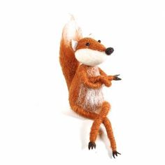 a stuffed fox is posed on its hind legs