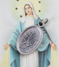 Traditional Miraculous Mary medal. This silver oxidized medal has gorgeous details and would be a lovely addition to your next rosary or jewelry project. It is imported from Italy and ready to be used in your next jewelry design. The Miraculous Medal is one of the most popular Catholic medals. It was created by St. Catherine Laboure following a vision of the Blessed Virgin Mary in 1830. This medal is believed to bring special intercessions on behalf of the Blessed Virgin Mary if worn with faith St Catherine Laboure, Catherine Laboure, The Immaculate Conception, The Blessed Virgin Mary, Immaculate Conception, Catholic Medals, St Catherine, Blessed Virgin, Blessed Virgin Mary