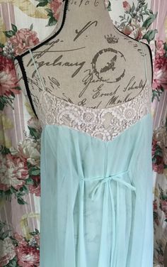 Gorgeous Sea-foam Green nightgown in size Small.  This is an amazing vintage nightgown by Claire Sandra by Lucie Ann. This lovely nightgown is semi sheer chiffon over semi sheer nylon.  Beautiful lace bodice that ties in front creating an elegant look. Also this has a pretty lace lining on the bottom of the skirt.  This is in perfect vintage condition.  There are no holes, stains, or rips.  Please feel free to ask me any questions you may have in regards to size as I do not accept returns due to