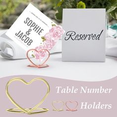 table number holders with roses and hearts on them