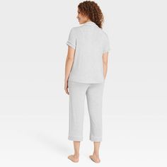 Add cool and comfy style to your everyday sleepwear collection with these Cloud-Knit Short-Sleeve Notch Collar Top and Cropped Pants Pajama Set from Auden™. Made from soft, stretchy fabric for a comfortable fit, this set includes a short-sleeve notch collar button-down top and cropped pants for a complete look. Plus, drawcord elastic waistband on the pants offers an adjustable fit. Wear the pieces as a set or mix and match with other PJs to put together a variety of sleepwear outfits. Auden™: Co Comfortable Cotton Solid Color Sleepwear, Comfortable Solid Color Cotton Sleepwear, Comfortable Cotton Sleepwear, Cozy Solid Cotton Sleepwear, Stretch Cotton Sleepwear For Loungewear, Comfy Stretch Sleepwear For Lounging, Relaxed Solid Color Sleepwear For Loungewear, Relaxed Solid Sleepwear For Loungewear, Comfy Stretch Solid Color Sleepwear