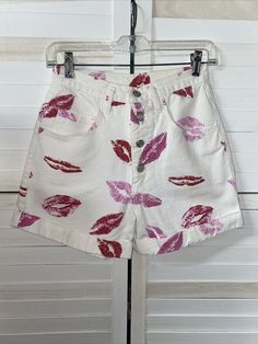 Vintage Copper Key 80s 90s White Denim Shorts Lipstick Kisses High Waist Small Super cute. Rate find. Very high waisted. Medium weight white denim with kisses of red and pinks all over. Button fly. 5 pocket design. Tagged a size 7/8 but will fit a small. Made in the USA. 100% cotton. Measurements laying flat Waist 26" Length 14" Inseam 3.5" Rise 13" White 90s Style Shorts For Summer, White 90s Style Summer Shorts, Retro White Summer Shorts, White High Waist Fitted Jean Shorts, Fitted High Waist White Jean Shorts, Retro White Bottoms For Summer, White Retro Bottoms For Summer, Retro White Summer Bottoms, Retro White Shorts For Spring