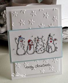 a christmas card with three snowmen on it