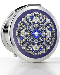 a blue and silver compact case with an intricate design