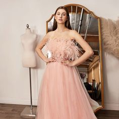 The Charming Dress Made Of Delicate Tulle Has A Structural Top Decorated With Sparkling Sequins, Which Together With Feathers Create A Glamorous Image. Fabric: Tulle Length:Long Colour: Blush Neckline: Off Shoulder Silhouette: A-Line Sleeve: Sleeveless Back: Zipper Skirt: Layered Embellishments: Sequin, Feathers Occasion: Romantic Date/Evening/Dinner, Wedding/Bridesmaid, Graduation, Fashion Show, Visiting Theater/Museum/Restaurant, Banquet, Photo Shoot, Concert, Ball Gown Tags: Off Shoulder Semi Wedding Dress With Feather Trim And Fitted Bodice, Formal Tulle Dress With Feather Trim, Spring Tulle Dress With Feather Trim, Spring Prom Dresses With Feather Trim, Pink Feather Trim Wedding Dress, Spring Wedding Dress With Feather Trim, Museum Restaurant, Illusion Dress Prom, Graduation Fashion