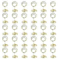 several circles and rings hanging from hooks on a white background, each with a single loop in the middle