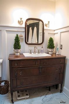 a bathroom with a sink and mirror in it