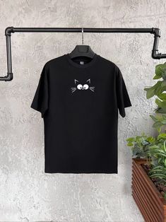 "Cat Face Printed T-Shirt | Funny Cat Print T-Shirt | Unisex Oversize Shirt | Graphic Tee | Animal Printed T-Shirt | Graphic Shirt | Christmas Party Tee | Men Party Wear | Cute Minimalist Shirt  Introducing our \"Cat Face\" Printed Unisex Oversize Black T-Shirt! Buy it with confidence if you are a cat lover or kitten lover. Premium quality, unique design 🐱👚 Add a purrfectly adorable touch to your wardrobe with our \"Cat Face\" Printed Unisex Oversize Black T-Shirt! Reflect your love towards kittens with your style 🌟😺 Round Neck, Comfort Fit, Short Sleeve and eyecatching unique design makes this t-shirt adorable. You can use it daily or wear it on special parties. Perfect t-shirt as a unique christmas, anniversary, birthday gift 🎁  Key Features: 😻 Charming Design: Our \"Cat Face\" pri Graphic Tee With Cat Print And Short Sleeves, Short Sleeve Graphic Tee With Cat Print, Cat Print Crew Neck T-shirt For Streetwear, Relaxed Fit Short Sleeve T-shirt With Cat Print, Graphic Tee With Cat Print For Streetwear, Cat Design Short Sleeve T-shirt For Streetwear, Oversized Crew Neck Tops With Cat Print, Oversized Cat Print Crew Neck Top, Relaxed Fit Short Sleeve T-shirt With Cat Design