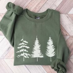 Camping Sweatshirts for Women Sweatshirt Pine Tree Evergreen Trees Gift for Nature Lover Travel Hiking Shirt Crewneck Spruce Pines Outdoors Embrace the beauty of nature and showcase your love for camping with our Camping Sweatshirt for Women. This cozy crewneck sweatshirt is the perfect companion for all your outdoor adventures. Featuring a stunning design of pine trees and evergreen trees, it captures the essence of the great outdoors and the serenity of the camping experience. The intricate de 3d Candle, Hiking Shirt, Sweatshirts For Women, Women Sweatshirt, Crewneck Design, Travel Hiking, Hiking Shirts, Evergreen Trees, Tree Gift