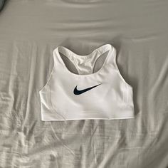 White Nike Sports Bra. Brand New With Tags! Little Padding But Good Support. Size Medium. Smoke Free, Dog Friendly Home. Nike Sports Bra And Sweatpants Set, Nike Gym Wear, Sleeveless Activewear With Built-in Padding For Sports, White Sports Bra With Built-in Padding, Nike Sports Bra With Built-in Padding, Sporty Go-dry Sports Bra For Sports, Sporty Sports Bra With Go-dry For Sports, White Stretch Tops With Built-in Padding, White Activewear With Built-in Padding For Gym