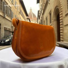 This bag has been made of the best genuine leather by local master crafters of Florence in Italy, designed for women who only accept premium Italian quality and luxury leather bags and modern Italian fashion. . Sizes: Width:   26cm/10.25inch Height:  18 cm/7 inch Depth:    9cm/3.6 inch color: Yellow . The story of this bag: Alessandro was on a mission to find the perfect gift for his girlfriend's upcoming anniversary. He wanted to surprise her with something special, something that would show he Brown Smooth Grain Saddle Bag, Soft Leather Saddle Bag For Business, Luxury Cognac Saddle Bag In Soft Leather, Luxury Cognac Soft Leather Saddle Bag, Leather Smooth Grain Saddle Bag, Leather Bags For Women, Handmade Leather Bags, Luxury Leather Bag, Perfect Gift For Him