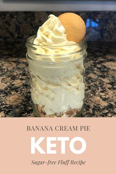 banana cream pie in a glass jar with whipped cream on top and the words keto below it