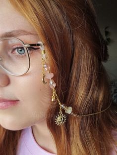 Elevate your eyewear game with our Pink and gold glasses chain featuring a stunning combination of rose quartz and yellow citrine crystals. This unique glasses chain is perfect for those who love celestial themes, as it features moon, star, and sun charms that will make you feel out of this world!  This eyeglass chain might be slightly heavier than regular chains because of some stone beads and crystals. Actual colors of any item or chains may slightly differ from screen to screen due to the screen resolution. I take our pictures in natural light during the day. If you want a custom request shoot us a message. We can make these crystal crowns and accessories with any of the crystals we have available (take a look at our shop to get an idea). Check out video footage of item on insta @myshin Affordable Adjustable Glasses Chains For Parties, Handmade Bohemian Glasses Chains, Glasses Chain Fashion, Glasses Chain Aesthetic, Fantasy Glasses, Paraguay Aesthetic, Korean Glasses, Eye Glass Chain, Eyeglasses Chains