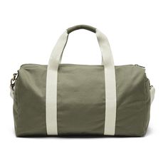 Embark on your adventures with this Weekend Duffle Bag—a conscious companion for your travels. This timeless and eco-friendly duffle bag is a testament to conscious travel and impeccable style. Fair Trade Certified 100% GOTS Certified Organic Cotton Canvas 1 Internal / 2 External Pockets Removable Shoulder Strap Dimensions: 19.5" x 11" x 9" This product supports underserved populations through fair trade employment Comes with a Story Card explaining the impact Customize your bag Add your logo wi Khaki Canvas Travel Bag, Travel Duffle Bag In Khaki Canvas, Green Practical Bags For Weekend Trips, Practical Green Bags For Weekend Trips, Khaki Canvas Duffle Bag For Travel, Versatile Green Duffle Bag, Green Practical Duffle Bag With Luggage Sleeve, Versatile Canvas Travel Duffle Bag, Green Functional Everyday Duffle Bag