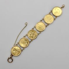 This is part of Chairish’s Fine Jewelry assortment.  This 22k gold coin bracelet features six British sovereigns in 10k gold surrounds connected with double loops and a spring ring clasp. The coins range in date from 1877 through 1900, each with the portrait of Queen Victoria at various stages of life. The coin contained the portrait of a teenaged Queen Victoria for over half a century (1838-1887)  until it was updated in 1887 with a more mature portrait to coincide with the queen’s Golden Jubil Gold Coins Bracelet, 1900 Jewelry, 17th Century Jewelry, Gold Coin Bracelet, Gold Coin Jewelry, Gold Coin Ring, Golden Coin, Stages Of Life, Golden Jubilee