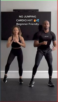 two people in black shirts and leggings are doing an exercise with each other