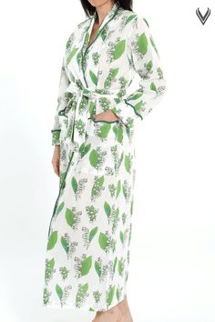 Start your day in this elegant robe for a stylish morning experience. Designed by Heidi, this robe features Lily of the Valley print - a flower that symbolizes happiness and luck is an ideal choice for you to make a classic morning statement. Unique fully scalloped trim is a sure sign of your classic style. This robe is designed to have a tailored fit . Heidi Carey Home Wear Collection #HeidiCarey Floral Print Spring Sleepwear, Spring Floral Print Sleepwear For Overnight, Floral Print Sleepwear For Overnight In Spring, Spring Overnight Robe With Long Sleeves, Spring Overnight Long Sleeve Robe, Elegant Spring Home Robe, Feminine Floral Print Robe For Loungewear, White Floral Print Kimono For Loungewear, Elegant Spring Vacation Robe