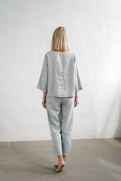 "When ordering you can choose to have the \"PANTS\" or \"TOP\" only or the whole \"PAJAMA SET\" of both items. When buying a set you save 5 euro. Comfortable relaxed fit EVA pajama pants in ice grey with pockets and fabric strap. Oversized CHLOE top in ice grey TOP: - length is ± 64 cm (25\") (depends on size) - wide mid-length sleeves - boxy fit BOTTOM: - outseam is ± 98 cm (38.5\") (depends on size) - inseam is ± 70 cm (27.5\") - elastic waistband with fabric strap - two side pockets DETAILS: Spring Sleepwear Sets In Relaxed Fit, Spring Sleepwear Sets With Relaxed Fit, Spring Season Relaxed Fit Sleep Sets, Casual Relaxed Fit Pant Set For Daywear, Relaxed Fit Casual Pant Set For Daywear, Oversized Cotton Sleepwear In Relaxed Style, Oversized Spring Loungewear Sets, Oversized Sleep Tops For Spring, Relaxed Fit Sleep Set With Long Pants