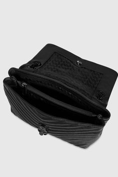 A classic in the making. The Edie Flap Shoulder bag, crafted in quilted genuine leather, toes the line between practical and glamorous. Style #: X F18MEQD37 100% Genuine Leather Black Shellac Hardware 12" W X 7" H X 3. 50" D 11-21" Strap Magnetic Snap Closure 1 Exterior Back Slip Pocket Triple Compartment with Center & Back Wall Zip Imported The photos featuring a model are for size reference only. Actual color and material may vary from what is depicted. | Rebecca Minkoff Edie Flap Shoulder Bag Black Shellac, Rebecca Minkoff Crossbody Bag, Convertible Crossbody Bag, Flap Shoulder Bag, Rebecca Minkoff Bag, Chevron Quilt, Quilted Crossbody Bag, Glamorous Style, Black Crossbody