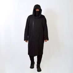 Very cool and comfortable unisex long hooded oversized coat with full zipper. Nice dense french terry fabric makes it cozy. It goes well with streetwear, gothic, punk, cyberpunk, militari, ninja, post-apocalyptic, jedi or sith styles, as easily as it fits in everyday wear. IMPORTANT! We can make a warmer version of the fabric with a fleece inside. If you want one, write to us. * 70% Cotton/ 30% Polyester. * Oversize. * Air-jet spun yarn with a soft feel and reduced pilling. * Strong overlock sea Oversized Cotton Parka Long Coat, Oversized Parka With Drawstring Hood, Oversized Long Sleeve Parka With Drawstring Hood, Oversized Techwear Hooded Jacket With Drawstring, Long Sleeve Techwear Hoodie For Cold Weather, Cold Weather Techwear Long Sleeve Hoodie, Oversized Black Parka For Streetwear, Techwear Long Sleeve Hoodie For Cold Weather, Urban Oversized Parka For Streetwear