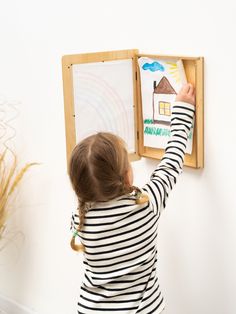 Showcase your little one's imagination and creativity with our elegant artwork display frame. Designed for convenience and accessibility, each frame can effortlessly hold multiple pieces of art or function as stylish wall decor. The interior of this easy-to-change artwork frame is sturdy, ensuring your child's masterpieces stay securely in place. Utilize the built-in hook of every white child artwork frame for easy display of your child's creations. Available in different colors, this versatile Changeable Art Frames, Kids Artwork Storage, Change Artwork, Kids Artwork Display, Displaying Kids Artwork, Kids Art Galleries, Kids Work, Stylish Wall Decor, Elegant Artwork