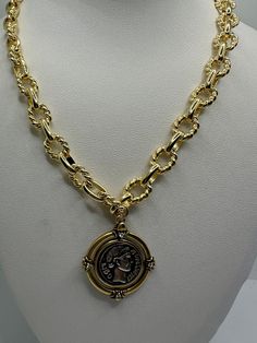 Our gold plated chain is made the highest quality We use gold filled components. 14K Gold plated  thick textured Shape link chain with Antique Bronze gold plating vintage medallion coin The vintage thick gold plated  necklace has a  long lasting color retention The necklace can be made in 18 Inches or 20 inches This chic Gold Chunky necklace gives a sophisticated look with any outfit! Gold Brass Medallion Necklace With Gold Chain, Gold-tone Metal Coin Necklace, Gold Plated Coin Necklace With Figaro Chain, Gold Brass Coin Necklace With Chain, Gold Plated Pendant Coin Necklace, Gold Coin Necklace With Figaro Chain Pendant, Gold Coin Pendant Necklace With Figaro Chain, Gold-plated Coin Necklace With Figaro Chain, Gold-plated Coin Pendant Necklace