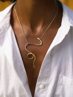 Our serpent necklace is hand forged out of bronze or sterling silver. This versatile necklace can be worn two ways. Simply slide the chain along the body of the snake to change it's hanging position. It drapes from gold filled or silver chain so effortlessly. Snake Shape Necklace With Adjustable Chain, Minimalist Gold Snake Necklace, Unique Adjustable Snake Chain Necklace, Minimalist Snake Shape Necklace With Adjustable Chain, Minimalist Snake Chain Necklace With Adjustable Chain, Elegant Sterling Silver Snake Necklace, Elegant Snake Clavicle Chain Necklaces, Elegant Snake Shape Necklaces With Clavicle Chain, Gold Sterling Silver Snake Chain Necklace