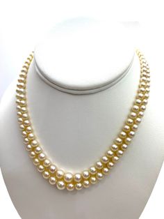 "Akoya Necklace with a 14 karat white gold clasp. Near round, cream color with pink overtone pearls. GIA certified, certificate shown in picture. One hundred fifty-four (154) drilled pearls in a graduated double strand necklace with a white metal clasp marked \"14KS\" and set with one transparent near-colorless round brilliant: Strand 1) 74 pearls Strand 2) 80 pearls. 33.90 grams (gross) Pearls ranging from 3.52 mm to 8.36 x 8.16 mm We ship within 1 day of receiving your order from Hawaii by fir Luxury Akoya Pearl Beaded Necklace, Classic Cream Pearl Necklace With Pearl Charm, Classic Cream Pearl Chain Necklace, Classic Cream Pearl Necklace, Classic Pear-shaped Pearl Necklace, Cream Pearl Necklace For Formal Occasions, Formal Cream Pearl Necklace, Classic White Gold Pearl Necklace In Pear Shape, Classic Cream Round Beads Jewelry