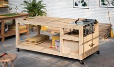 a workbench made out of plywood and wood