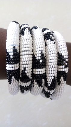 Bracelets | Custom Bracelets | Mother's Gift | Gift Idea | Bangles | Unique Gift | Bracelets For Women | Yoga Bracelets | Daughters Gift These superbly crafted Zulu beaded bracelets are made of fine beads which can be worn in any occasion. Color - White and black. Feel free to send me a convo or e-mail for any clarification. Thank you for visiting... Adjustable Beaded White Bangle, White Beaded Bangle With Round Beads, Adjustable White Beaded Bangle, Traditional White Round Beads Stretch Bracelet, Traditional White Round Bead Stretch Bracelet, Traditional White Stretch Bracelet With Round Beads, White Beaded Round Wristband, Traditional White Beaded Bangle, White Bracelets With Black Beads