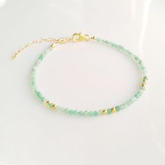 Minimalist, wearable, and delicate 14k gold filled green emerald bracelet for everyday wearing. Length: from 5,5" (14 cm) to 8" (20 cm) with 1" (2.5 cm) 14k gold-filled extensor chain. Width: 2 mm 14k gold-filled beads and green emerald beads. Material: 14k gold filled strong lobster clasp. Handmade in Spain. Ideal for a gift to jewelry lovers. All our products are presented in a white organza bag. If you want a different color scheme, ask us and we will design it for you :) Green Emerald Bracelet, Green Beaded Bracelets, Miyuki Bracelet, Green Bracelet, Emerald Bracelet, Gold Armband, Emerald Bead, Birthstone Bracelet, Bracelet Dainty