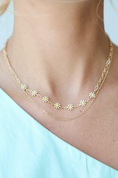 Cute and colorful meets upscale vibes in the Bridget Gold Flower Charm Layered Necklace! This trendy necklace features two layers of gold chains with flower charms. Style the Bridget Necklace with any outfit to instantly add a chic touch to your look! Available in 3 colors. Gold Plated Layered Flower Charms Lobster Clasp with Extender Layer 1 | Length 7.5" Layer 2 | Length 7" Extender | Length 3" Gold Flower Pendant Necklace For Spring, Spring Gold Jewelry With Flower Charm, Gold Necklace With Flower Charm For Spring, Dainty Gold Flower Necklace For Spring, Spring Gold Necklace With Flower Charm, Gold Flower Pendant Jewelry For Spring, Trendy Gold Jewelry For Spring, Trendy Summer Flower Charm Necklace, Trendy Flower Necklace For Spring