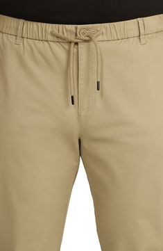 Cropped pants with a relaxed, tapered leg are cut from comfortable cotton that's soft, a little stretchy and finished in a light, versatile hue. Zip fly with button closure Drawstring waist Front slant pockets; back button-welt pockets 96% cotton, 4% elastane Machine wash, line dry Imported Spring Everyday Khaki Chinos, Casual Tapered Beige Pants, Casual Beige Chinos For Spring, Casual Tapered Beige Bottoms, Spring Beige Tapered Leg Chinos, Casual Beige Chinos For Summer, Beige Casual Chinos For Summer, Casual Beige Tapered Leg Chinos, Beige Cotton Tapered Leg Bottoms