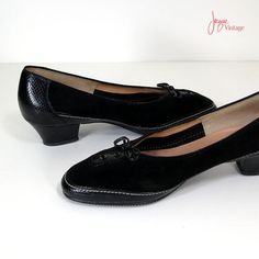 "Vintage 1970's or 80's pumps in black suede and embossed leather.  Beautiful details include lacing at the toe with patent leather bow and tiny brass hoop fittings, contrast white stitching, padded arch support in leather, and sturdy non-slip rubber sole.  A very feminine shoe that's comfortable and superbly made.  Label: Selby (rubber sole marked Contura).      S I Z I N G      printed size8 1/2 inside length10\"  inside width3\" heel height1 1/2\"      C O N D I T I O N      Excellent.  Two small dings on the right heel.       MORE VINTAGE SHOES      http://www.etsy.com/shop/JacquieVintage?section_id=6769886      BROWSE MY SHOP      http://etsy.com/shop/jacquievintage      CONNECT WITH ME      twitterjacquievintage facebookwww.facebook.com/JacquieVintage   pinterestjacquievintage" Shoes 80s, 80s Shoes, Feminine Shoes, Low Heel Pumps, Black Leather Pumps, Black Suede Pumps, Leather Bow, 70s Vintage, Leather Bows