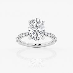 a diamond engagement ring on a white background