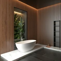 a large white bath tub sitting inside of a bathroom