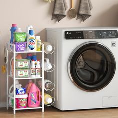 a white washer sitting next to a dryer in a room