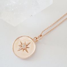 A pendant necklace featuring a celestial starburst dotted with a tiny crystal in its center. Length: adjustable between 21"- 24". Charm measures .5" x .5". Our materials make for an amazing, high quality, seamless, jewelry piece with longevity. Our necklaces are plated with 18k gold, 18k rose gold, or rhodium and finished with a protective coating. A little secret we’ll keep between us: it looks way more than it costs. Cat Charm Necklace, North Star Necklace, Lucky Charm Necklace, Starburst Necklace, Star Necklace Gold, Silver Bar Necklace, Toggle Necklace, Gold Bar Necklace, Charm Necklace Silver