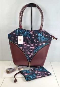 Wine Red Floral Pattern Nylon Faux Leather Tote Bag w/Clutch Set of 2 Wine Red and Floral Pattern Nylon, Faux Leather Tote Bag and Clutch Show your style and class by carrying this stunning set of a tote bag and a clutch. It is made with premium material. This set has ample space to keep all your essentials safe and organized. Carry this bag set when heading outdoor, shopping, traveling, or more. This bag set goes well with any outfit of your choice.PREMIUM MATERIAL: Durable and shiny faux leath Faux Leather Tote Bag, Ankara Bags, Red Floral Pattern, Outdoor Shopping, Bag Set, Leather Tote Bag, Wine Red, Red Floral, Leather Material