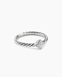 a white gold ring with a heart shaped diamond on the front and side, set in silver