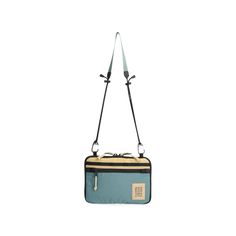 a blue and black bag with straps hanging from it's side on a white background