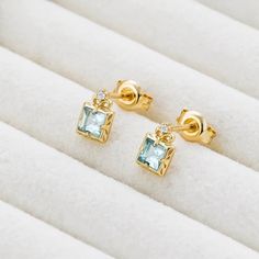 ✦ Embrace your love for geometric shapes with the S925 Square Shape Natural Aquamarine CZ Stud Earrings, which feature a stylish and modern design. The clear blue hue of the natural aquamarine stones is perfectly complemented by the sparkling cubic zirconia stones, creating a stunning contrast that is both eye-catching and elegant. The square shape of the earrings adds a touch of geometric sophistication to any outfit, making them the perfect accessory for the modern woman. The high-quality cons Stud Design, Square Stud Earrings, Elegant Gothic, Basic Jewelry, Nose Rings Hoop, Crystal Hoop Earrings, Square Earrings Studs, Square Stud, Aquamarine Stone